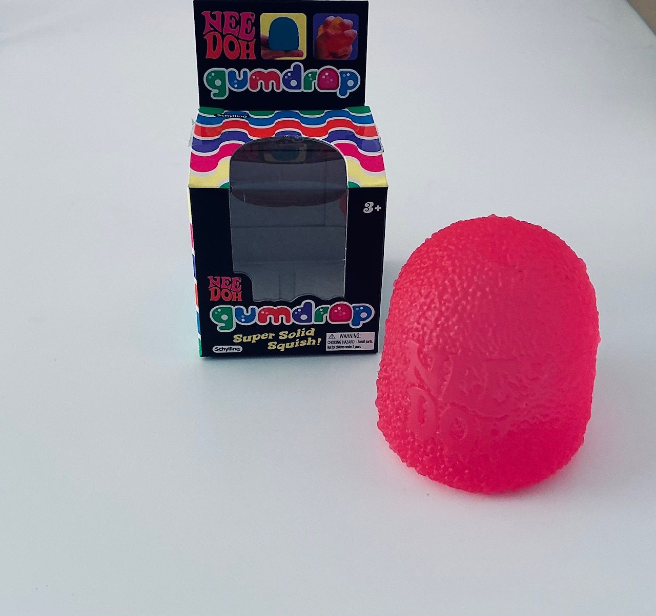 Household photograph of a pink NeeDoh Gumdrop